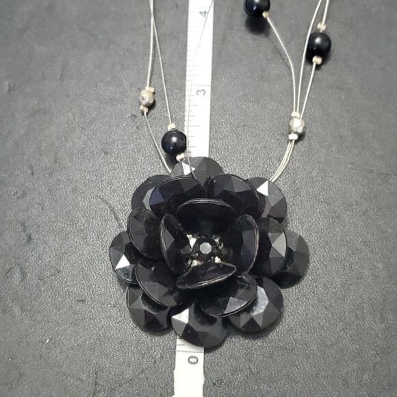 Silver tone black flower floating necklace - Picture 7 of 11